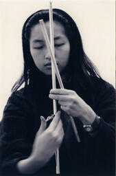 Woman with dowels, circa 1992-1994.