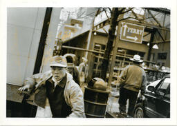 Man in front of Granville Island public market, circa 1992-1994.