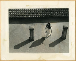 Woman between two pillars, circa 1983.