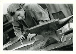 Man in metal shop, circa 1992-1994.