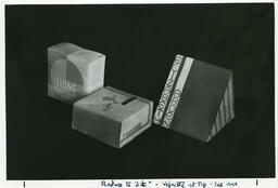 Three packaging mockup boxes, date unknown.