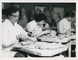Female students work with clay, date unknown.