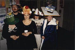 Staff wear silly hats, circa 1990s.