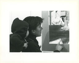 Woman and baby look at artwork, BCYA "Changing Images", 1981.