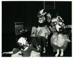 Women in costumes at event, circa 1986-1995.