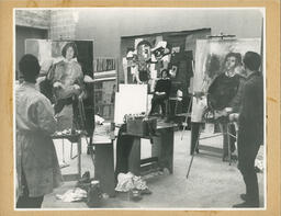 Model sits in painting studio, circa late 1950's - early 1960's.