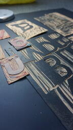 Texts carved on lino board