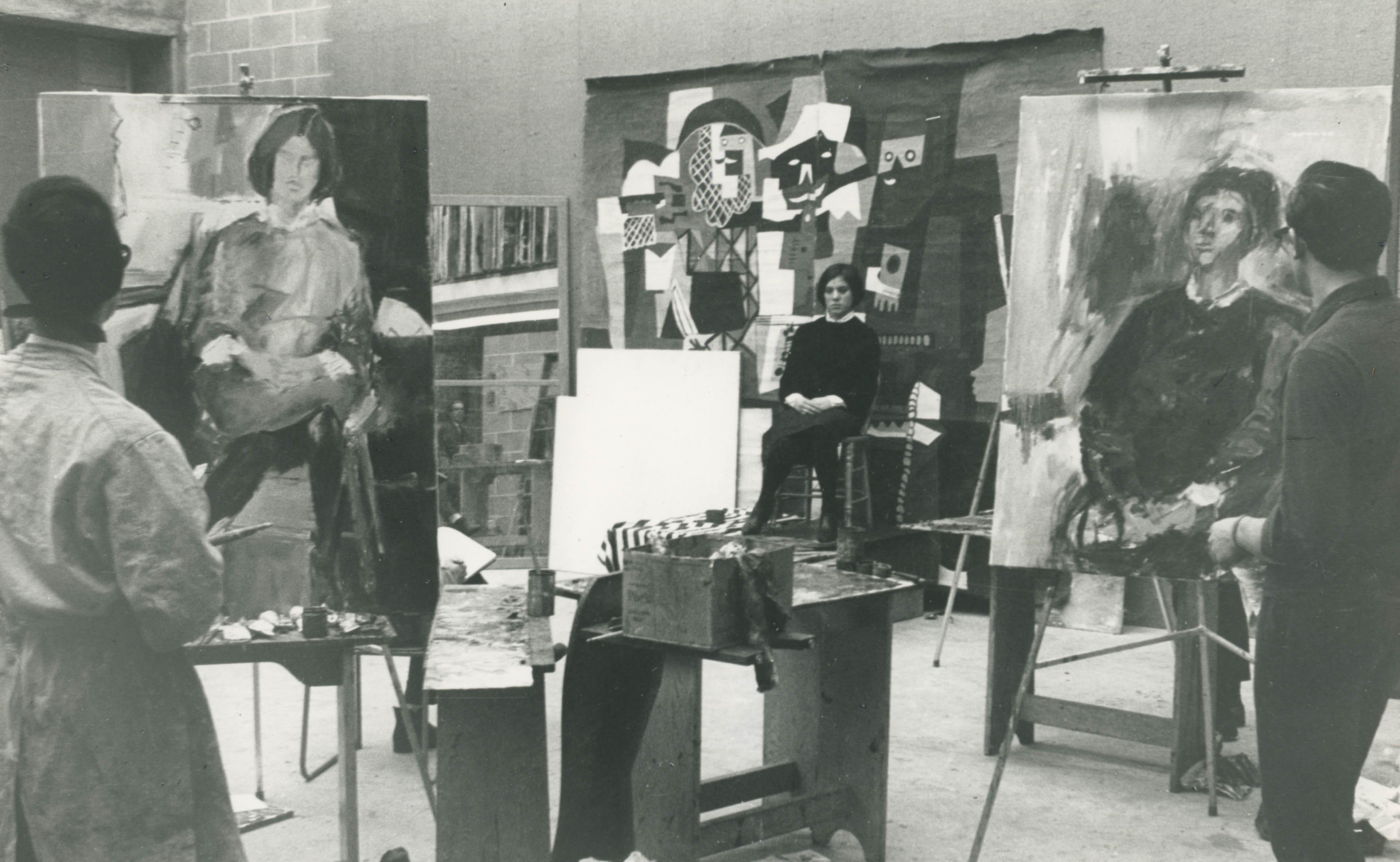 Model sits in painting studio, circa late 1950's - early 1960's